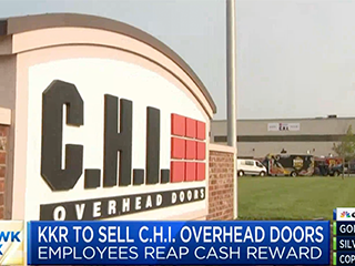 A C.H.I. Overhead Doors sign is in view outside of a building.